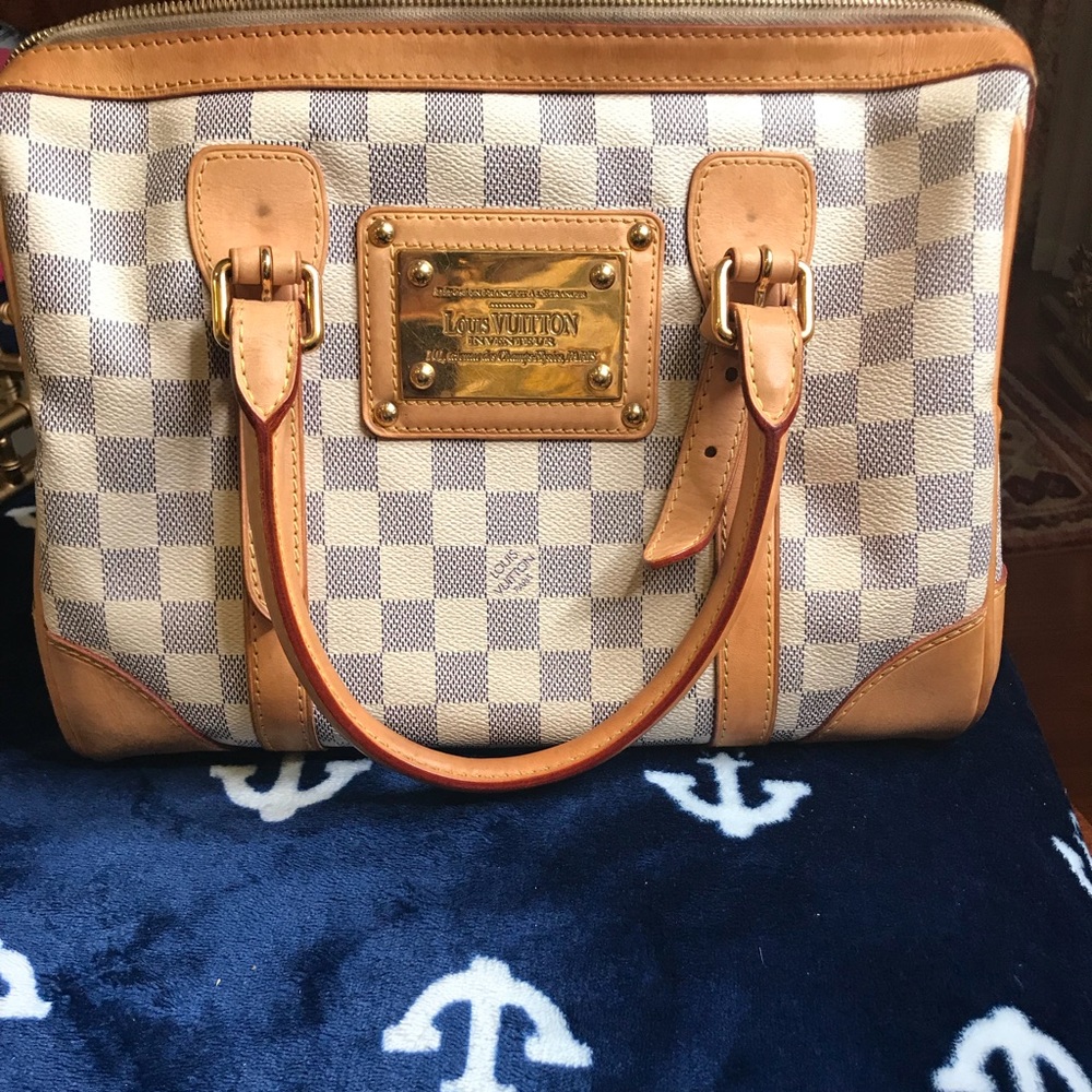 White Louis Vuitton handbag